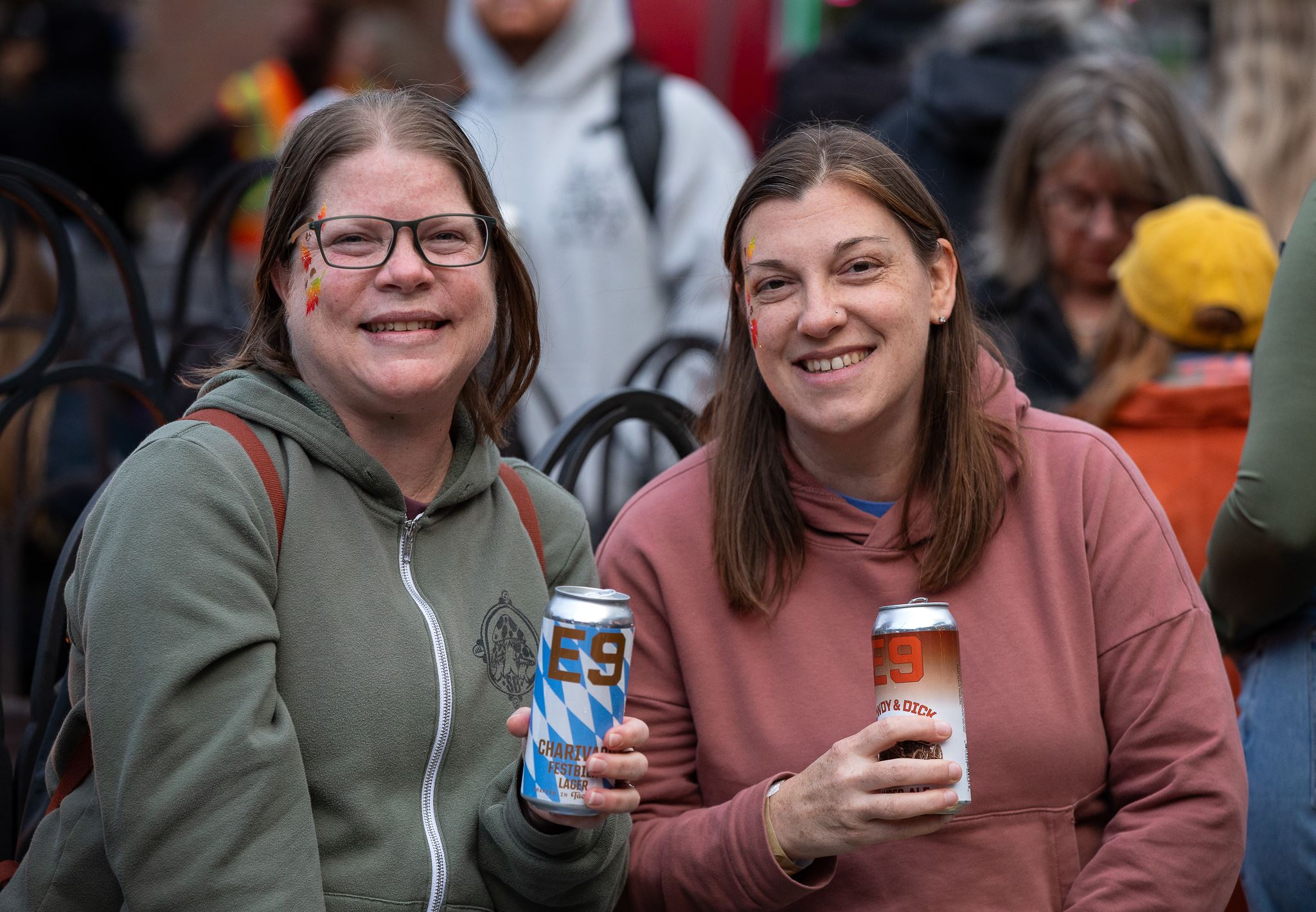 two women holding beers