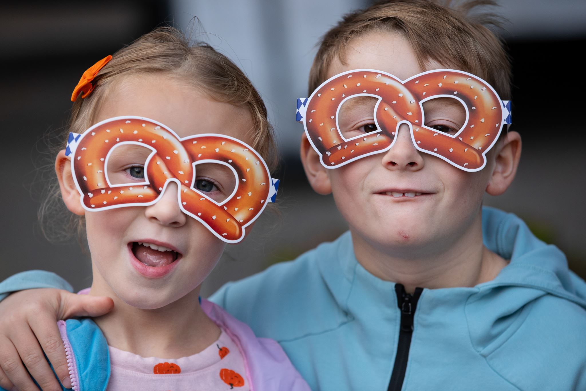 two children with pretzel masks on